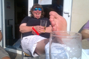 Fi icing her ankle and enjoying a purely medicinal  post Hickley Tiller refreshment on the Colne Yacht Club balcony.